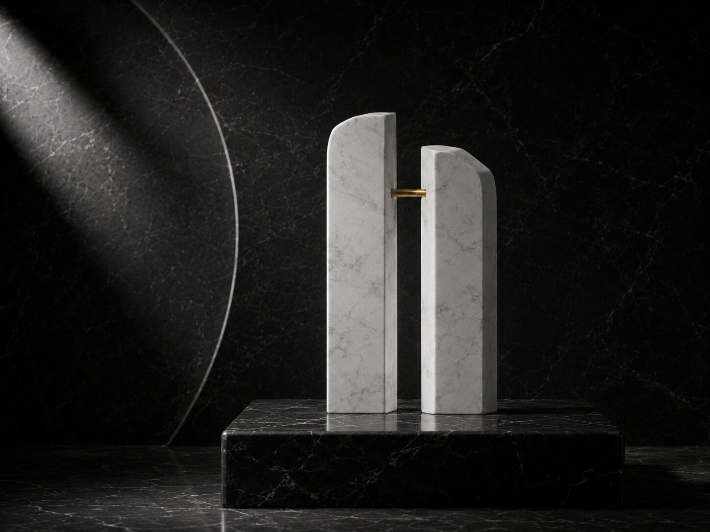 Two marble forms joined by a gold rod on black marble.